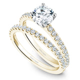 A Noam Carver yellow gold engagement ring with 20 diamonds.