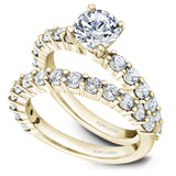 A Noam Carver yellow gold engagement ring with 12 diamonds.