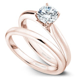 A Noam Carver rose gold engagement ring with a round centerpiece.
