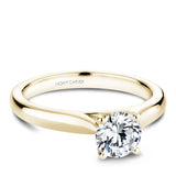 A Noam Carver yellow gold engagement ring with a round centerpiece.