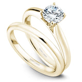A Noam Carver yellow gold engagement ring with a round centerpiece.