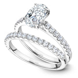A Noam Carver white gold engagement ring with an oval centerpiece and 30 diamonds.