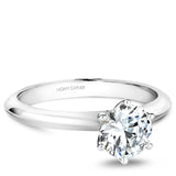 A Noam Carver white gold engagement ring with a round centerpiece.