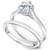 A Noam Carver white gold engagement ring with 12 diamonds.