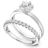 A Noam Carver white gold engagement ring with a round centerpiece.