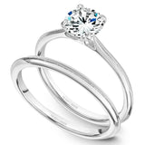 A Noam Carver white gold engagement ring with a round centerpiece.