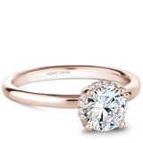 A Noam Carver rose gold engagement ring with 16 diamonds.