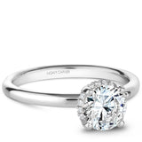 A Noam Carver white gold engagement ring with 16 diamonds.