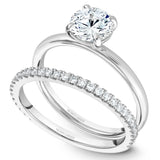 A Noam Carver white gold engagement ring with a round centerpiece.