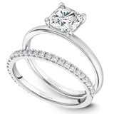 A Noam Carver white gold engagement ring with a cushion cut centerpiece.