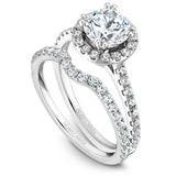A Noam Carver white gold engagement ring with a round halo and 42 diamonds.
