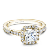 A Noam Carver yellow gold engagement ring with a princess cut center diamond, a halo and 52 diamonds.