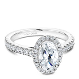 A Noam Carver white gold engagement ring with an oval cut center diamond, a halo and 54 diamonds.