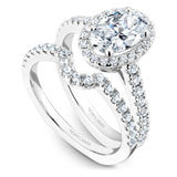 A Noam Carver white gold engagement ring with an oval cut center diamond, a halo and 54 diamonds.