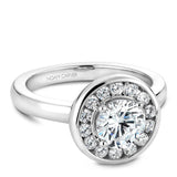A Noam Carver white gold engagement ring with 14 diamonds on a round halo.