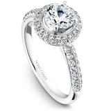 A Noam Carver white gold engagement ring with a round center stone on a halo and 68 diamonds.
