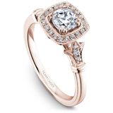 A Noam Carver rose gold engagement ring with a cushion cut center stone, a halo and 26 diamonds.