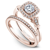 A Noam Carver rose gold engagement ring with a cushion cut center stone, a halo and 26 diamonds.