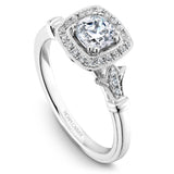 A Noam Carver white gold engagement ring with a cushion cut center stone, a halo and 26 diamonds.
