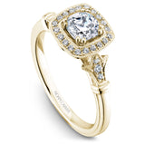 A Noam Carver white gold engagement ring with a cushion cut center stone, a halo and 26 diamonds.