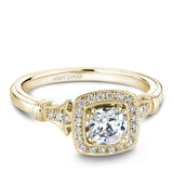 A Noam Carver white gold engagement ring with a cushion cut center stone, a halo and 26 diamonds.