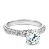 A Noam Carver white gold engagement ring with 66 round diamonds and a round halo.