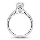 A Noam Carver white gold engagement ring with 66 round diamonds and a round halo.