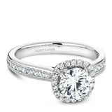 A Noam Carver white gold engagement ring with a round halo, 42 diamonds and milgrain detailing on a band.