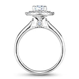 A Noam Carver white gold engagement ring with a round halo and 69 diamonds.