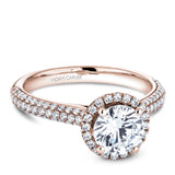 A Noam Carver rose gold engagement ring with a round halo and 108 diamonds.