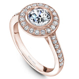 A Noam Carver rose gold engagement ring with a round halo and 32 diamonds.