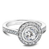 A Noam Carver white gold engagement ring with a round halo and 32 diamonds.
