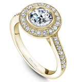 A Noam Carver yellow gold engagement ring with a round halo and 32 diamonds.