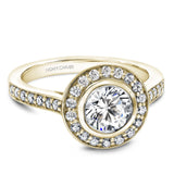 A Noam Carver yellow gold engagement ring with a round halo and 32 diamonds.