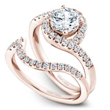 A Noam Carver rose gold engagement ring with a round halo and 32 diamonds.