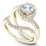 A Noam Carver yellow gold engagement ring with a round halo and 32 diamonds.