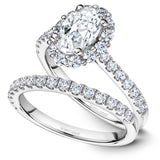 A Noam Carver white gold engagement ring with an oval halo and 26 diamonds.