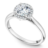 A Noam Carver white gold engagement ring with a round halo and 16 diamonds.