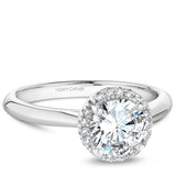 A Noam Carver white gold engagement ring with a round halo and 16 diamonds.
