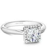 A Noam Carver white gold engagement ring with a square halo and 16 diamonds.