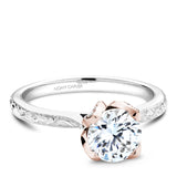 A Noam Carver engraved white and rose gold engagement ring with 52 diamonds on a band and a floral setting.