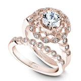 A Noam Carver rose gold engagement ring with a floral halo and 18 round diamonds.