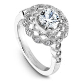 A Noam Carver white gold engagement ring with a floral halo and 18 round diamonds.