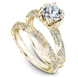 A Noam Carver yellow gold engagement ring with a round centerpiece and a floral band dazzled with 100 diamonds.