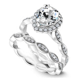 A Noam Carver white gold engagement ring with a pear center stone, 36 round diamonds and a floral band.
