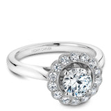 A Noam Carver white gold engagement ring with 14 diamonds on a floral halo.
