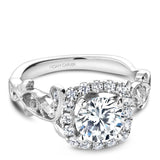 A Noam Carver white gold engagement ring with a cushion halo, 18 round diamonds and a detailed floral band. 