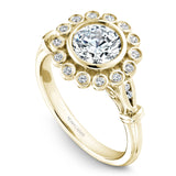 A Noam Carver yellow gold engagement ring with 18 round diamonds on a floral halo and a detailed band.
