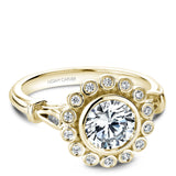 A Noam Carver yellow gold engagement ring with 18 round diamonds on a floral halo and a detailed band.