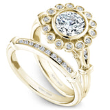 A Noam Carver yellow gold engagement ring with 18 round diamonds on a floral halo and a detailed band.